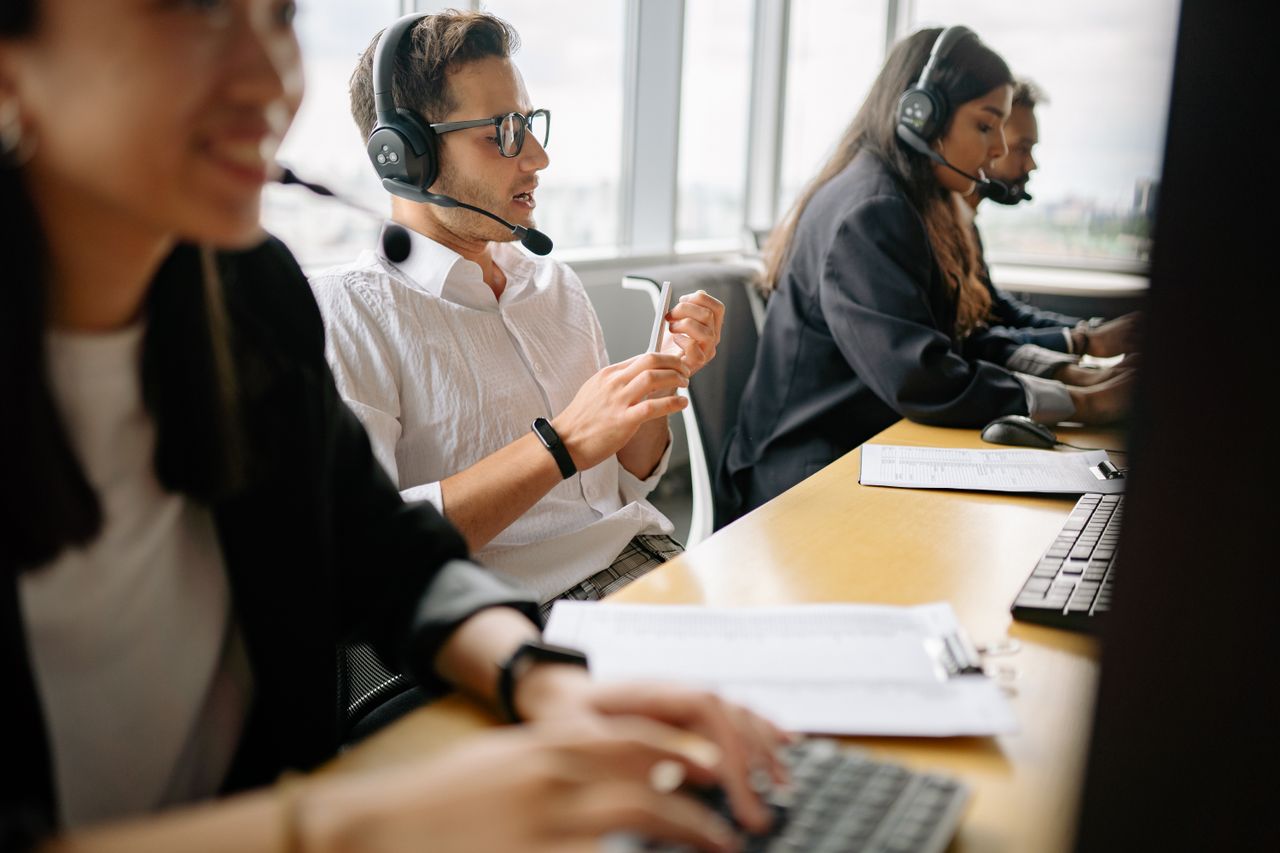 A support team working together at their desks
